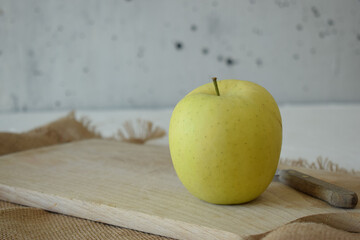 Wall Mural - Ripe yellow apple is fresh in the kitchen