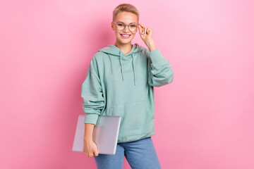 Photo portrait of pretty young girl laptop touch specs confident employee dressed stylish khaki outfit isolated on pink color background