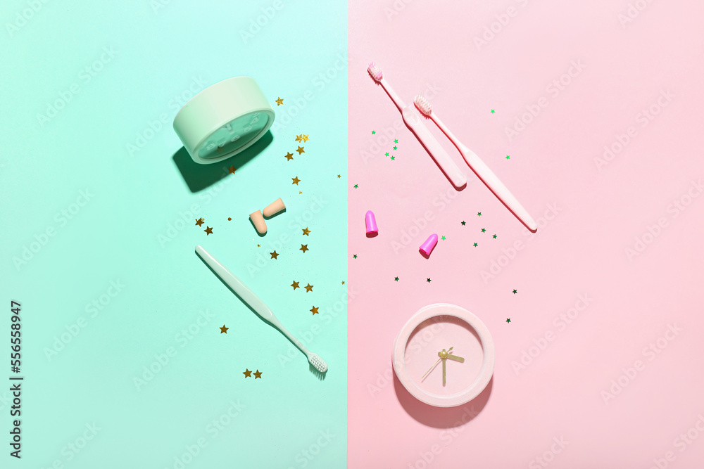 Composition with earplugs, toothbrushes and alarm clocks on color background