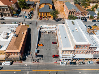 Aerial scenic view of Victorian building on historic Main C street in downtown Virginia City. Cars parked along the street of Virginia, Nevada, USA