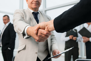 Wall Mural - businessman confidently shaking hands with his business partner.