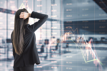 Canvas Print - Back view of stressed young european woman standing in blurry office interior with falling red index candlestick graph. Crisis, market fall, recession and money loss concept. Double exposure.