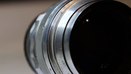 Poster - old vintage lens rotates in a circle. High quality 4k footage