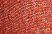 Knitted Fabric Textured Background. Knitting. Colorful Red-orange Knitted Pattern. Red Yarn.