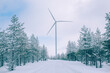 Aerial view Wind turbine in snow winter landscape in Finland. Alternative energy in winter.