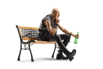 Canvas Print - Pensive punk sitting on a bench with a bottle of beer