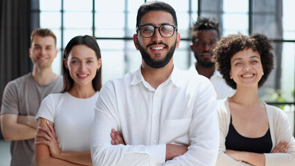 Smiling professional business leaders and employees group team portrait