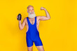Photo of cute sportive man pensioner dressed blue overall rising sport powder jar showing biceps empty space isolated yellow color background