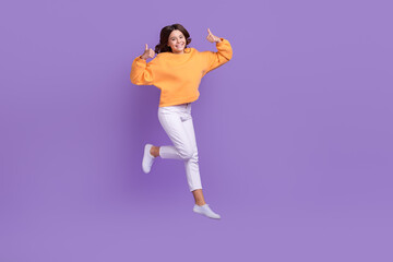 Wall Mural - Full size photo of carefree girl jumping show thumbs up feedback rate isolated on violet color background