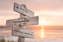 Always Remember Where You Came From Text Quote Engraved On Wooden Signpost Outdoors At The Beach. Sunset Theme.
