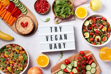 Vegan Or Veganuary Feast With Various Salads Ad Healthy Plates On Light Gray Table