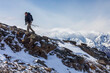 © Designpics - A hiker ascends a snowy ridge in the Alaska Range; Alaska, United States of America