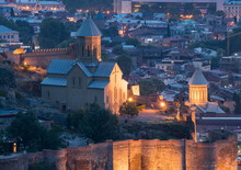 St Nicholas Church, Restored In The 20th Century And Illuminated At Dusk, Located In The Lower Court Within The Ancient Narikala Fortress In The Capital City Of Tbilisi; Tbilisi, Georgia