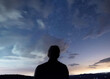 © Designpics - Silhouette of a man looking up at a star filled sky along Skyline Drive in Shenandoah National Park in Virginia.