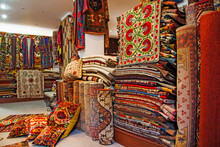 Rugs for sale at a shop in Bodrum, Turkey.; Inside a Turkish carpet shop, in Bodrum, western Anatolia, Turkey.