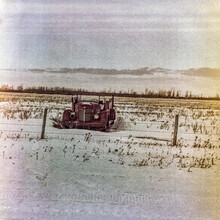 Vintage Car Abandoned In The Countryside In A Snowy Field; Manitoba, Canada