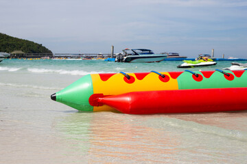 Wall Mural - A banana boat on the beach. Summer concept