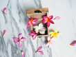 Piece of white marble with colorful flowers in a wooden box
