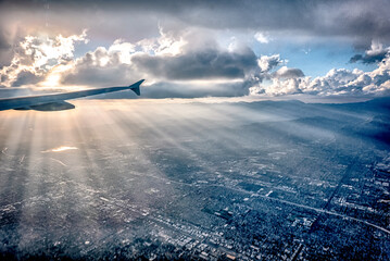 Fototapete - flying over city of los angeles at sunset