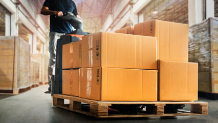 workers unloading package boxes on pallet in warehouse. electric forklift loader. cartons cardboard 