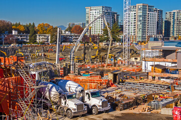 Wall Mural - New construction of high-rise buildings in Richmond city, industrial construction site, construction equipment, construction crane and foundation pouring machine