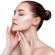 © Galaxy_love_design - Graphic lines shows facial lifting effect on skin of beautiful woman.