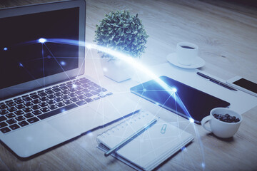 Poster - Computer on desktop with social network hologram. Double exposure. Concept of international people connections.
