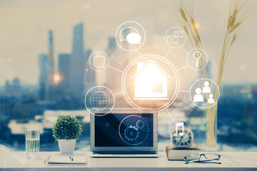 Poster - Desktop computer background in office and big town buildings hologram drawing. Double exposure. Smart city concept.