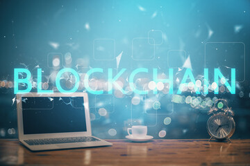 Poster - Multi exposure of blockchain theme hologram and table with computer background. Concept of bitcoin crypto currency.