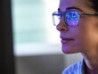 © Connect Images - Female expert in glasses looking at screen with financial data
