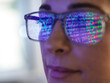 © Connect Images - Female expert in glasses looking at screen with financial data