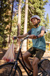 © Connect Images - USA, California, Tahoe City, Boy riding bicycle with plastic bag