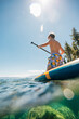 © Connect Images - USA, California, Rear view of boy paddleboarding on Lake Tahoe
