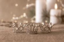 Happy Epiphany Day Concept. Three Silver Crowns, Symbol Of Tres Reyes Magos (Three Wise Men) On Beige Bokeh Background.