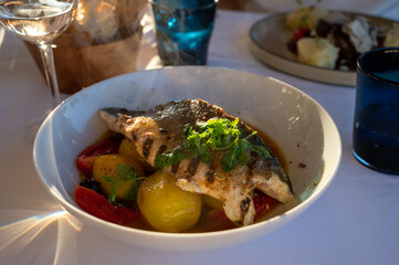 Poster - Provence cuisine, filet of seabass white fish served with potatoes, tomatoes and .Bouillabaisse jus in French restaurant