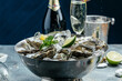 Fresh oysters with lemon and ice. Restaurant delicacy. oysters dish. Oyster dinner with champagne in restaurant. menu, dieting, cookbook recipe