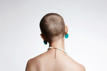 Wall Mural - beautiful woman with short haircut. back of naked bald girl