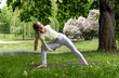 © Наталья Жукова - young girl doing yoga in the park in nature in summer