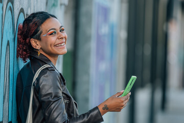 Canvas Print - urban girl with mobile phone in the street