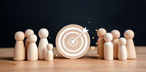 target and goal concept, Wooden figures standing around dartboard and arrow for creative and set up business objective target goal, marketing solution, target for business investment.