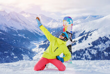 Girl Snowboarder Enjoys The Winter Ski Resort.