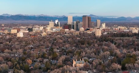 Wall Mural - Flying backwards from downtown of Denver, morning light, wide angle, blue clear sky