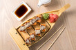 japanese sushi, rolls on a wooden structure