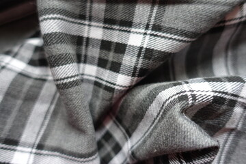 Crumpled gray, black and white cotton flannel tartan fabric