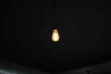 Modern Retro Interior Light Bulb Illuminated In Dark Room 