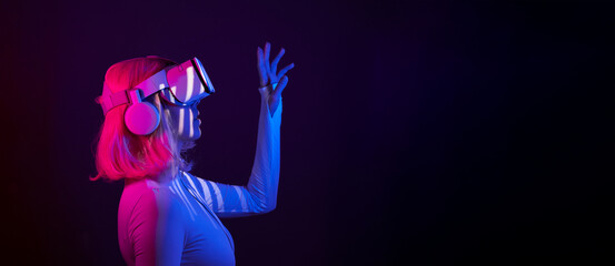 Poster - Woman in virtual reality goggle in neon colors.