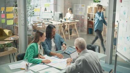 Poster - Diverse Group of People Talking in a Casual Modern Meeting Room in Office Using Laptop Computer. Group of Colleagues From Different Ethnicities Collaborating, Working as a Team on Crisis Management. 