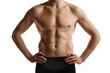 © master1305 - Cropped image of muscular male body, hands, belly. Man posing shirtless in black underwear over white studio background. Men's health and beauty