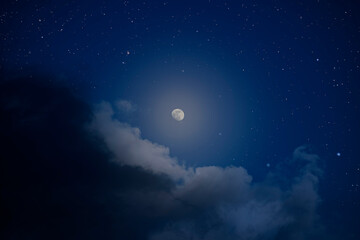 Wall Mural - moonlit night sky with clouds and stars
