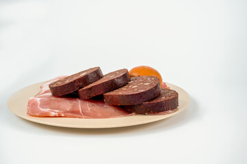 plate of ingredients for a traditional English breakfast isolated on white background